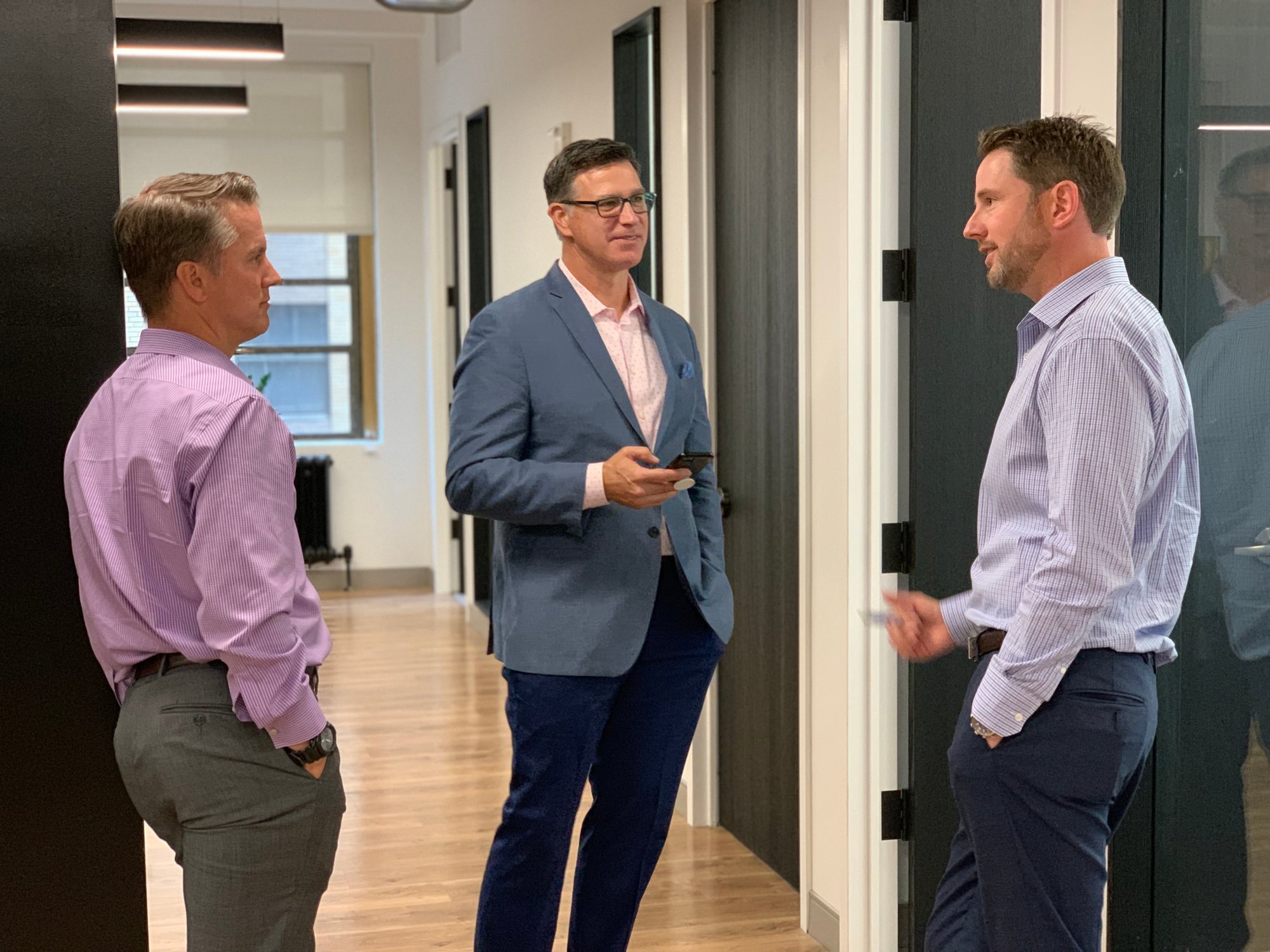 JH Men talking corporate