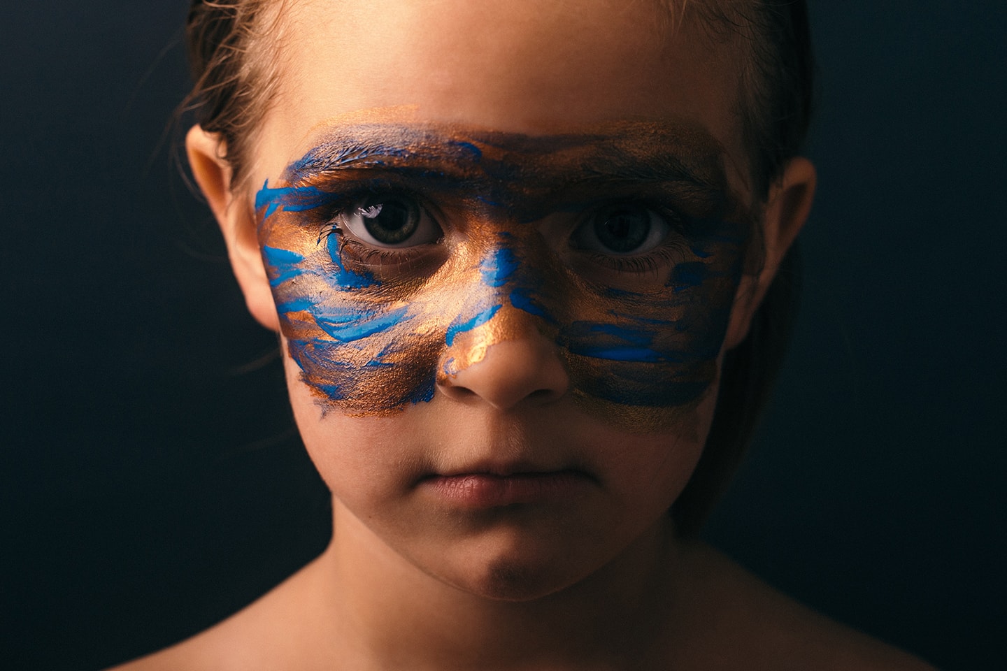 Head shot of Child with face paint